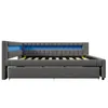 A grey upholstered daybed with blue LED lighting along the headboard, shown from the side against a white background. Voir les images du produit