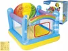 An inflatable play structure with a rainbow theme, shown from a slightly elevated angle. Voir les images du produit