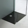 A close-up view of a modern black shower tray with a silver drain. Produktbild-Vorschau