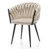 A beige upholstered chair with black legs against a white background. Podgląd zdjęcia produktu