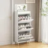 A white shoe cabinet with a mirror on top, filled with shoes, is placed next to a white door and a window with curtains. Produktbild-Vorschau