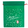 A green Christmas gift bag with white and red festive decorations. Produktbild-Vorschau