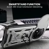 A close-up shot of a phone case with a ring stand, placed on a surface with a laptop and headphones in the background. Produktbild-Vorschau
