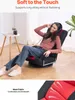 A woman is sitting on a floor chair and wearing headphones. The image also includes text describing the product's features. Voir les images du produit