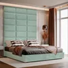 A modern bedroom with a tall, upholstered headboard and a neatly made bed. Anteprima dell’immagine prodotto