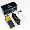 A flat lay of a laser detector kit, including the product, its packaging, a battery, a mount, and instructions. Produktbild-Vorschau