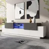 A modern living room with a TV cabinet, artwork, and a book on the floor. Náhľad obrázku produktu