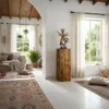 A living room with a wooden decorative column, a sofa, and rugs. Anteprima dell’immagine prodotto