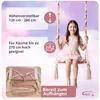 A young girl is sitting on a pink swing in a room with a cloudy sky background. There are text overlays with product features and a logo. Podgląd zdjęcia produktu