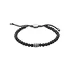 A black beaded bracelet with a silver accent piece is shown against a white background. Produktbild-Vorschau