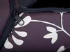 A close-up of a dark purple fabric with a white floral pattern and a black zipper. Produktbild-Vorschau