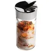 A clear studio shot of a spice jar filled with salt and dried herbs. Produktbild-Vorschau
