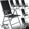 Multiple black folding chairs are arranged in a studio setting against a white background. Produktbild-Vorschau