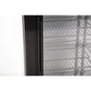A close-up view of the interior of a commercial refrigerator, showing the wire shelves and the black handle of the door. Produktbild-Vorschau