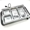 A stainless steel electric food warmer with four compartments. Voir les images du produit