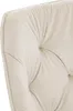 A close-up view of a tufted, cream-colored upholstered chair. Produktbild-Vorschau