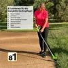 A woman is using a green and black cordless trimmer in a grassy area next to a paved path. Produktbild-Vorschau