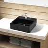 A black square ceramic sink with a silver faucet is placed on a white countertop. Below the countertop, there are folded white towels. Podgląd zdjęcia produktu