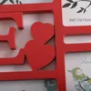 A close-up view of a red photo frame with heart shapes and text indicating photo size. Náhľad obrázku produktu