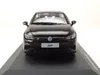 A black Volkswagen Golf VIII R model car displayed on a black base. Produktbild-Vorschau