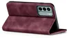 A burgundy flip case for a smartphone is shown standing upright on a white background. Produktbild-Vorschau