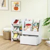 A white children's bookshelf with storage bins and books is shown in a room. Produktbild-Vorschau