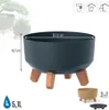 A dark gray planter with wooden legs is shown on a white background, with dimensions and capacity indicated. Náhled obrázku produktu