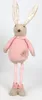 A stuffed bunny toy standing against a white background. Voir les images du produit