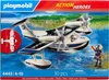 A Playmobil police seaplane toy set on its packaging, with a seaplane, a pilot figure, and a background depicting water and trees. Produktbild-Vorschau