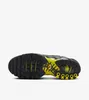 The underside of a black and yellow Nike Air Max Plus sneaker against a white background. Náhled obrázku produktu