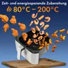 An air fryer with fried chicken and shrimp flying into it. Produktbild-Vorschau
