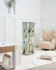 A child's room with a rotating bookshelf, a chair, and a table. Náhled obrázku produktu
