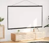 A white projection screen is hung on a white wall above a wooden media console. Podgląd zdjęcia produktu