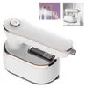 A white and rose gold handheld steam iron is shown against a white background. In the upper left corner, there is a smaller inset image showing the steam iron being used to steam clothes hanging on a rack. In the upper right corner, there is another smalle Produktbild-Vorschau