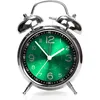 A close-up studio shot of a retro analog alarm clock with a green face. Voir les images du produit