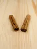Two cinnamon sticks on a wooden surface. Podgląd zdjęcia produktu