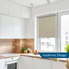 A modern kitchen with white cabinets, a wooden backsplash, and a window with a beige roller blind. Produktbild-Vorschau