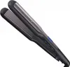 A black and gray Remington hair straightener is shown against a white background. Podgląd zdjęcia produktu