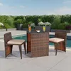 A patio set with two chairs and a table next to a swimming pool. Anteprima dell’immagine prodotto