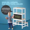 A smiling toddler stands next to a white wooden learning tower with a chalkboard that has 'ABC' written on it. The background is a solid blue. Anteprima dell’immagine prodotto