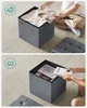 A collage showing two views of a storage ottoman. The top view shows clothing being placed inside, and the bottom view shows books being placed inside. Produktbild-Vorschau