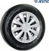 A car wheel with a silver hubcap on a white background. Produktbild-Vorschau