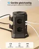 A black power strip tower with multiple outlets and USB ports is shown on a wooden desk. Produktbild-Vorschau