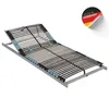 A slatted bed base with an adjustable headrest, shown from a diagonal angle on a white background. A sticker indicating "Made in Germany" is visible in the upper right corner. Produktbild-Vorschau