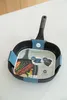 A grill pan is placed on a white countertop. Voir les images du produit