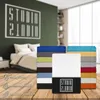 A stack of colorful fitted sheets is displayed in front of a bedroom scene, with icons and text highlighting product features. Produktbild-Vorschau