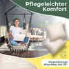 A woman is sitting in a hanging chair indoors, using a laptop. The scene is set in a living room with furniture and plants in the background. There are also images of pillows and a washing machine icon. Produktbild-Vorschau
