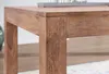 A close-up view of the corner of a wooden table. Anteprima dell’immagine prodotto