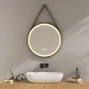 A modern bathroom vanity with a round LED mirror above a vessel sink. Produktbild-Vorschau