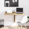 A wall-mounted folding desk with a laptop, books, and office supplies. Produktbild-Vorschau